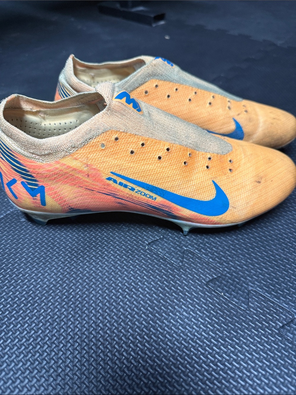 Nike Men’s Orange Soccer Boots with Blue Swoosh
